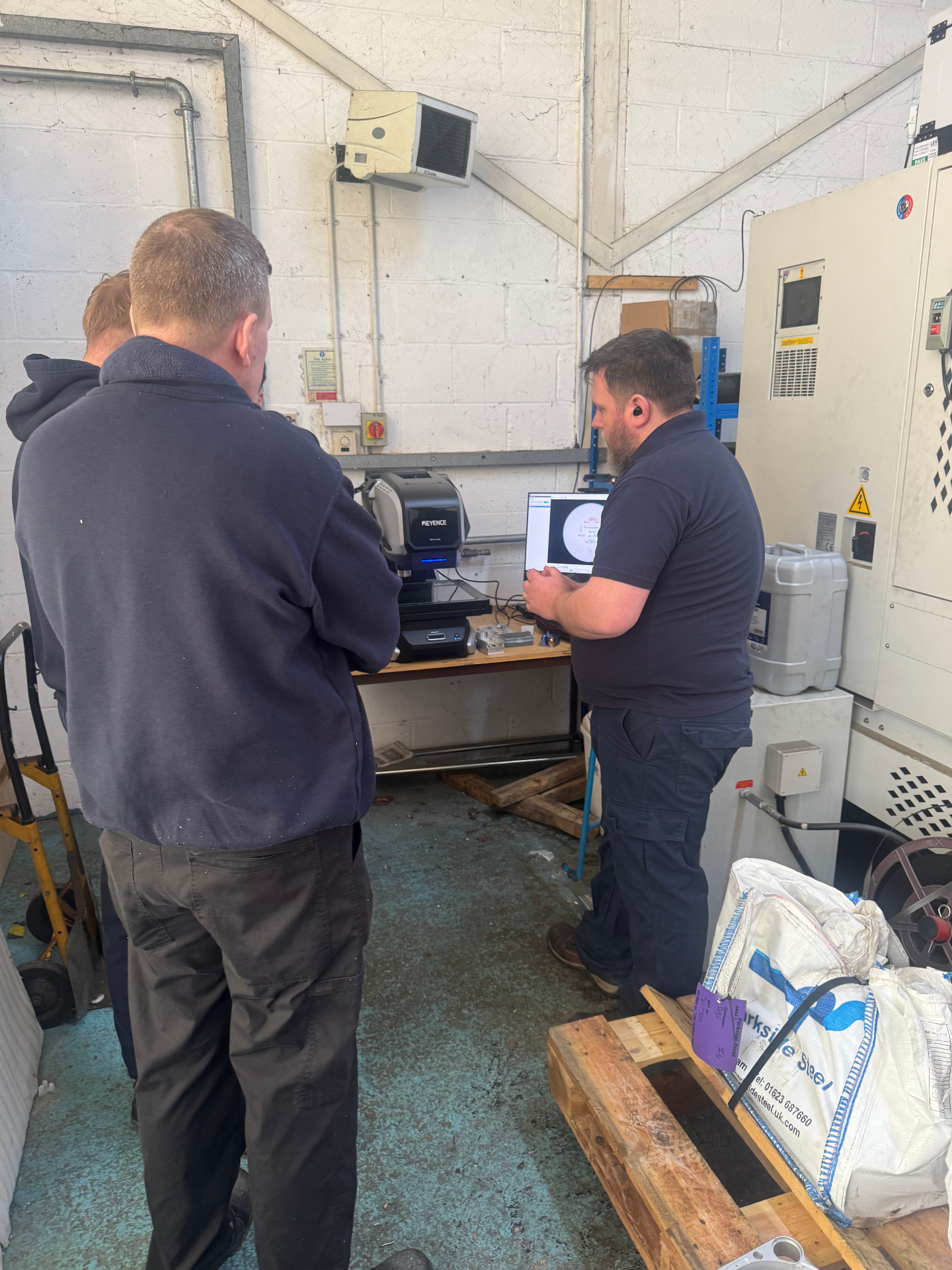 DGF Engineering team evaluating a KEYENCE measurement system
